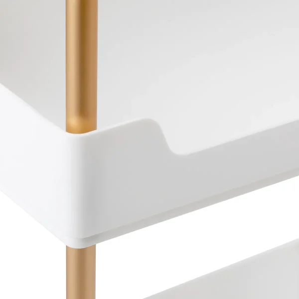 Κοντινή λήψη της σύνδεσης του λευκού ραφιού με τον χρυσό/χάλκινο μεταλλικό σκελετό του Helper 127.