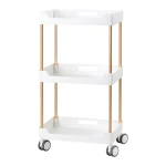 Επαγγελματικό τροχήλατο βοηθητικό τραπεζάκι αισθητικής 127 σε λευκό χρώμα με χάλκινους σωλήνες.