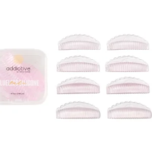 Σετ 4 ζευγαριών glueless σιλικονάκια lash lift L-curl με οδηγούς, δίπλα στη ροζ θήκη μεταφοράς τους.