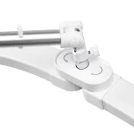 Λεπτομέρεια της άρθρωσης της λευκής λάμπας Glow Arche που επιτρέπει την πλήρη περιστροφή των ημιτόξων της κεφαλής.